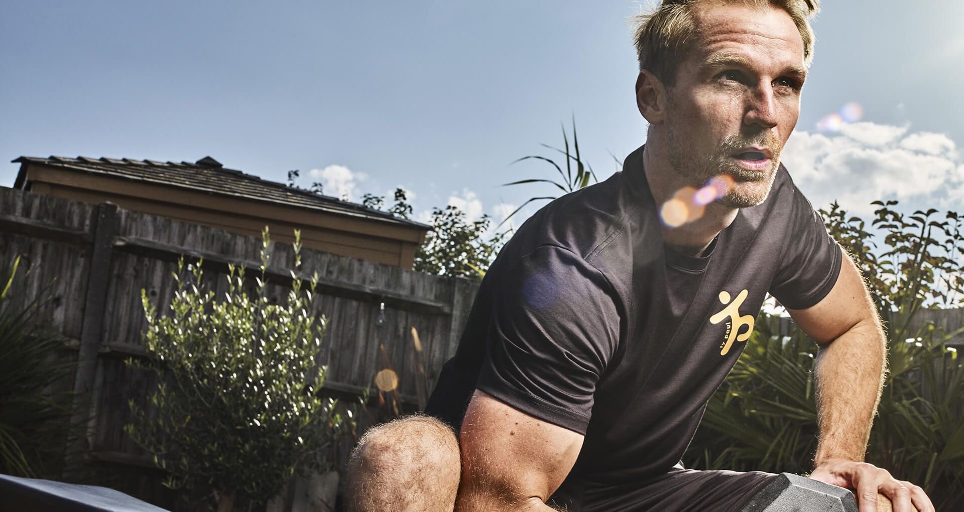 Ty Paul Personal Training working out in a garden